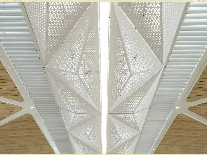 Perforated metal sheet used for modern ceiling design in an interior space