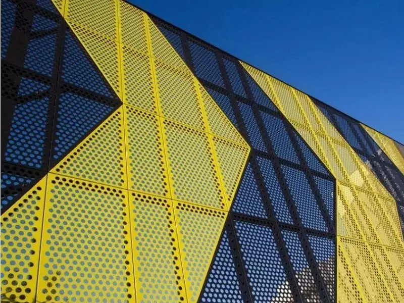 Perforated metal sheet used as exterior wall cladding on a modern building