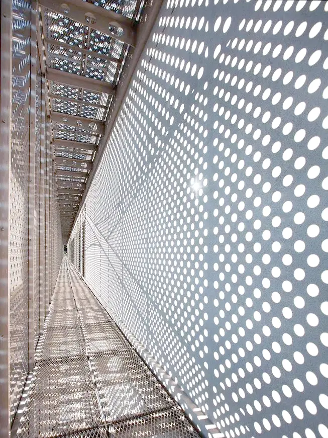 Perforated metal panels with unique light and shadow effects.