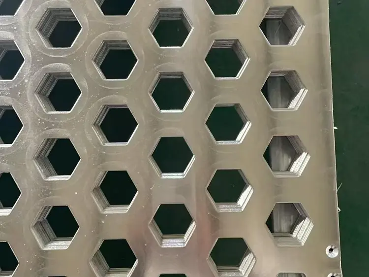 Steel sheet with precision punched perforations