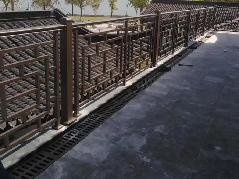 Ornamental iron railing installed on residential balcony