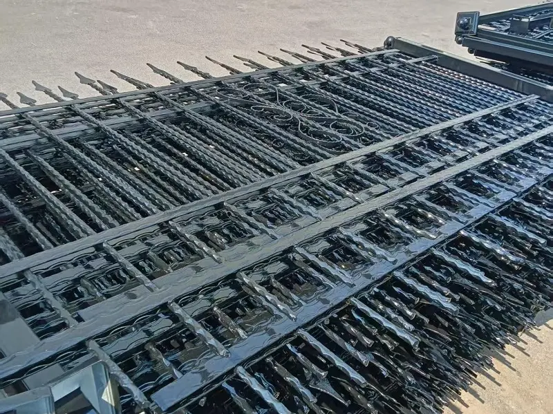 Unassembled ornamental iron fence panels stacked for delivery