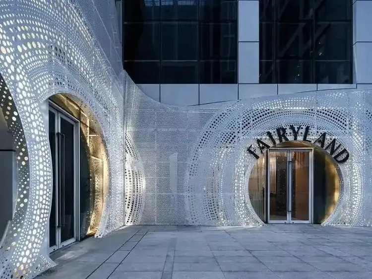 Architectural facade featuring perforated metal panels in modern building design