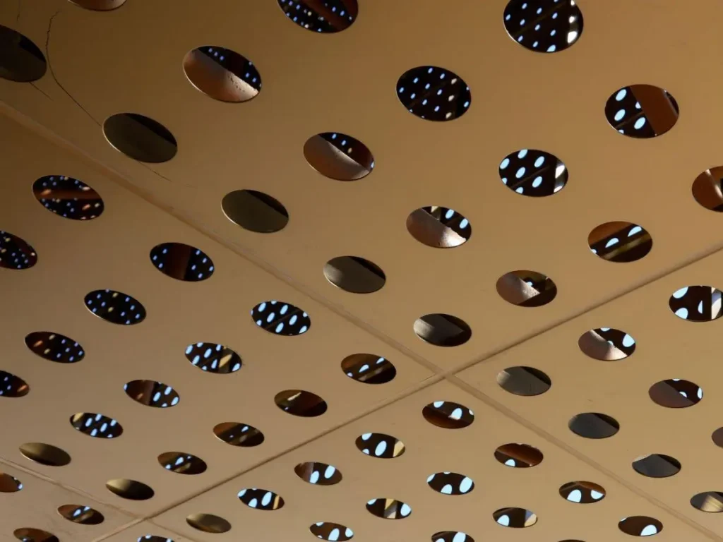 Perforated metal ceiling panels in modern building