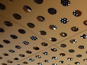 Perforated metal ceiling panels in modern building